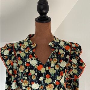 Fun yet flattering blouse you can easily dress up or down.